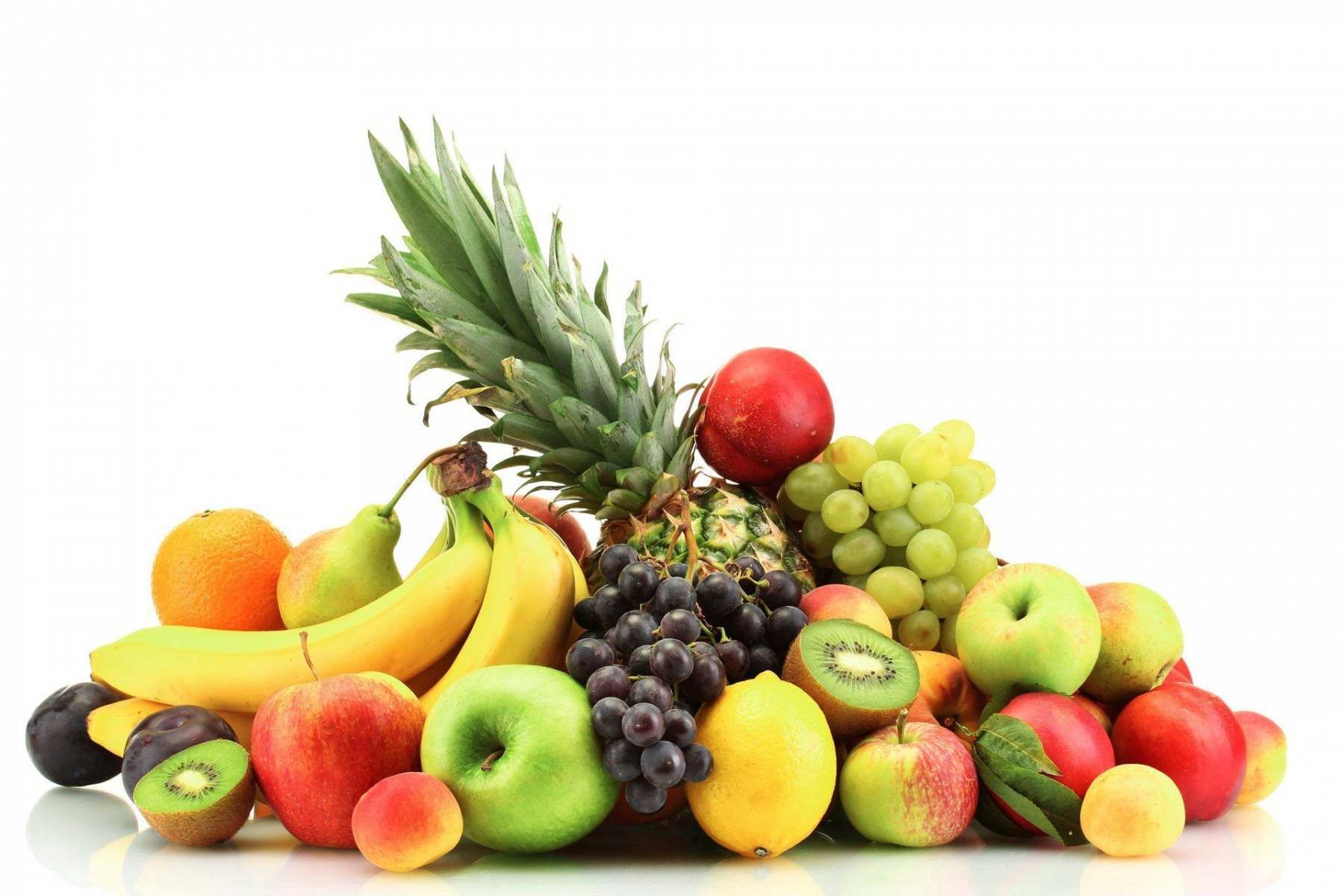 Pineapple, grapes, apples, oranges and bananas at Evans and Clark greengrocer Rogerstone