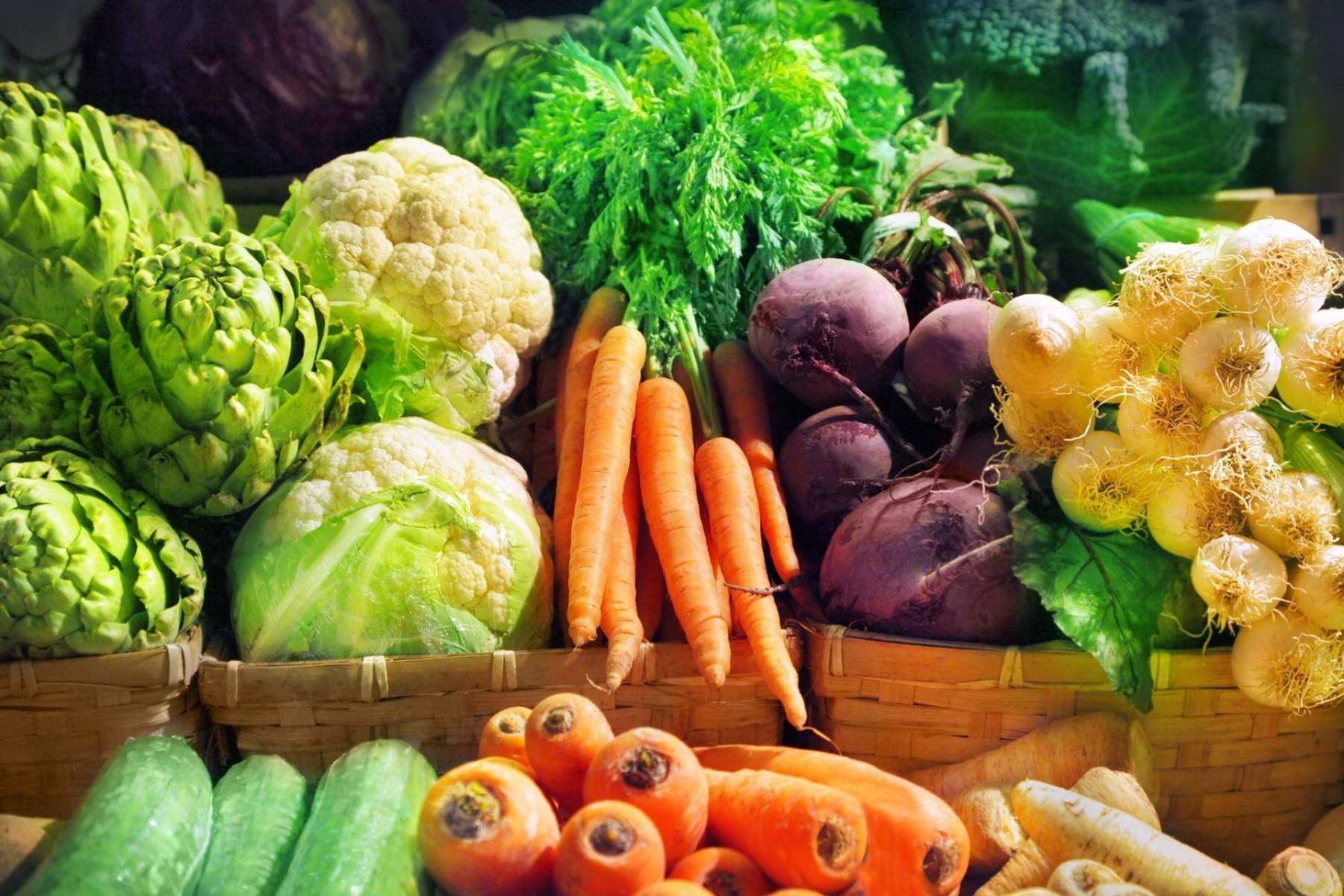 Crates of fresh cabbages, carrots, beetroot and onions at Evans and Clark greengrocer Rogerstone